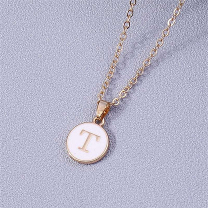 YourLetter White Enamel Circle Necklace with gold detailing and custom letter pendant.