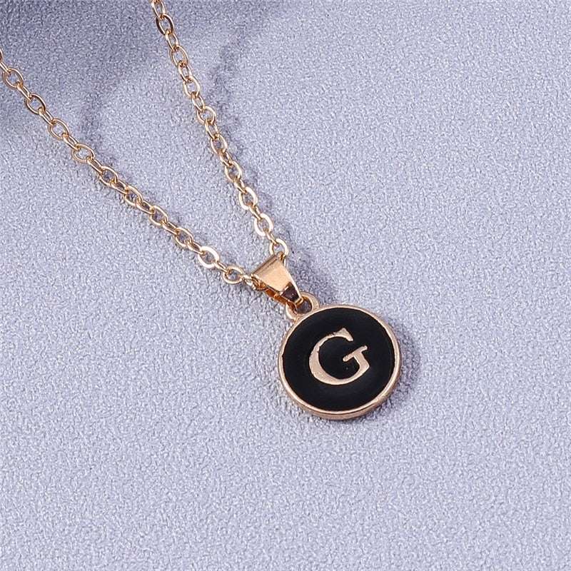 YourLetter Black Enamel Necklace with letter pendant on gold chain.