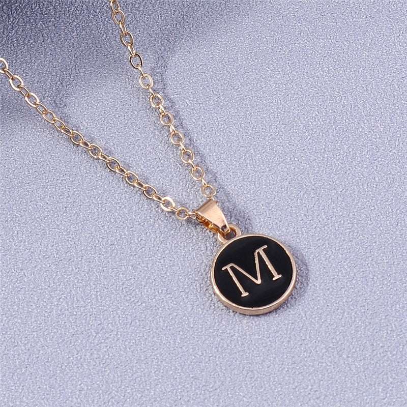 YourLetter Black Enamel Necklace with gold alloy and customizable letter pendant on chain.