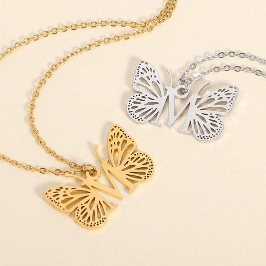 Butterfly Wings A-Z YourLetter Necklace with gold and silver butterfly-wing pendants.