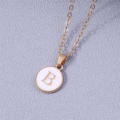 YourLetter White Enamel Circle Necklace with Gold Letter Pendant.