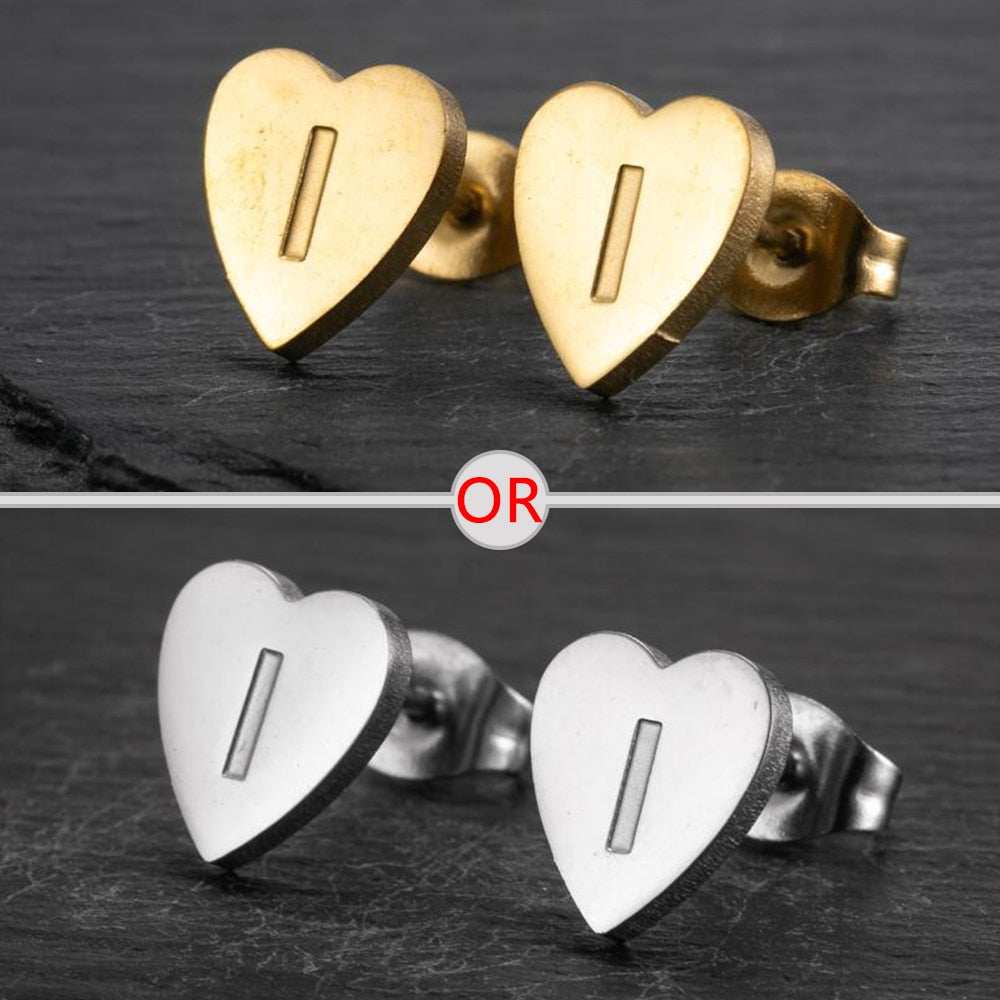 Heart-shaped stud earrings with personalized initial, available in gold or silver finish.