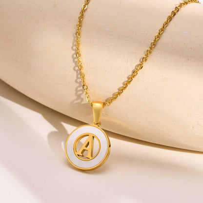 Hollow Shell Circle YourLetter Pendant Necklace with gold alloy and customizable letter design.