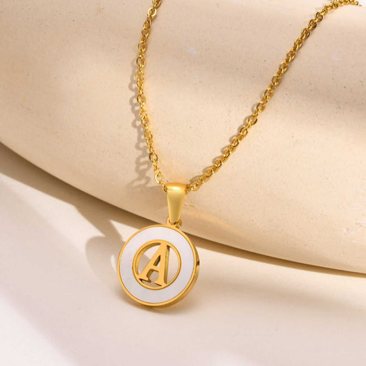 Hollow Shell Circle YourLetter Pendant Necklace with gold alloy and customizable letter design.