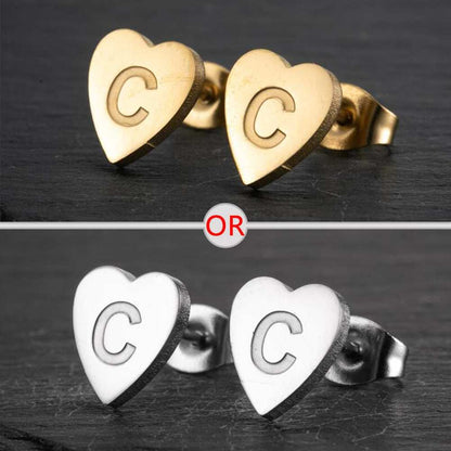 Heart-shaped stud earrings with personalized initial, available in silver and gold finish.