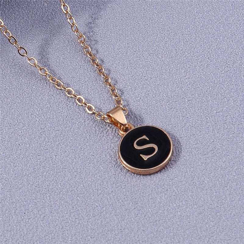 YourLetter Black Enamel Necklace with gold chain and customizable letter pendant.