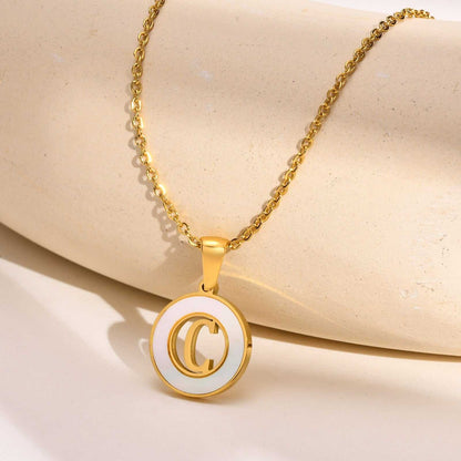 Hollow Shell Circle YourLetter Pendant Necklace in gold metal alloy with customizable letter.