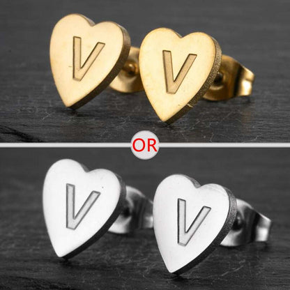 Personalized initial heart stud earrings in silver and gold finish.