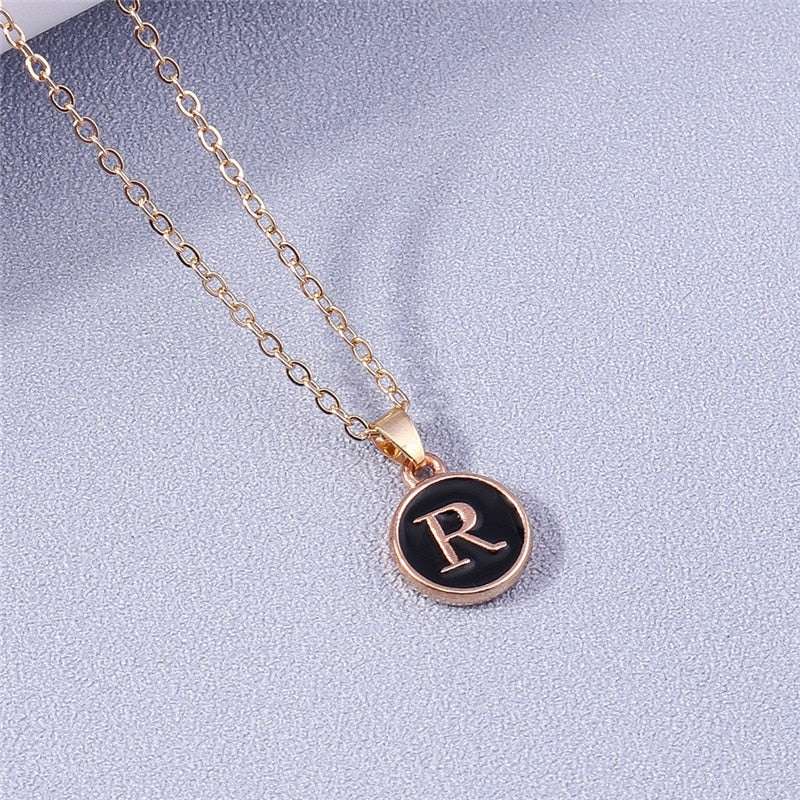 YourLetter Black Enamel Necklace with personalized letter pendant.