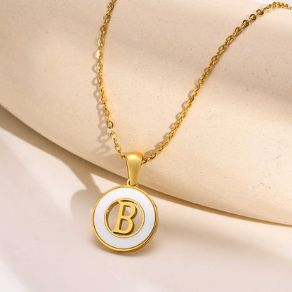 Hollow Shell Circle YourLetter Pendant Necklace in gold-colored metal with customizable letter.