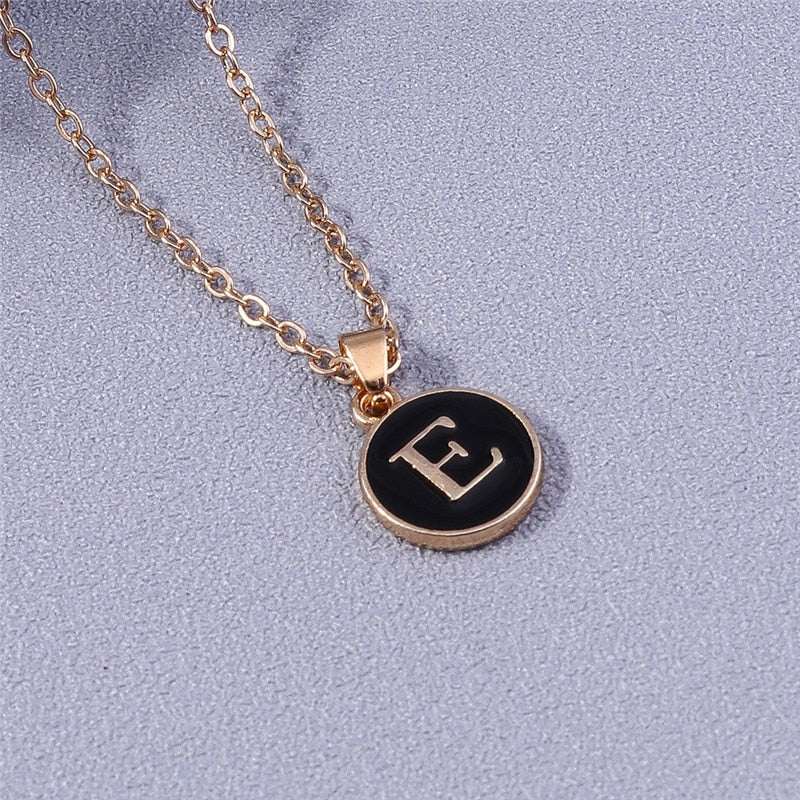 YourLetter Black Enamel Necklace with customizable letter pendant in gold color on a chain.