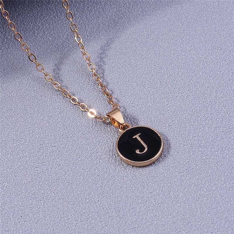 YourLetter Black Enamel Necklace with personalized letter pendant on gold chain.