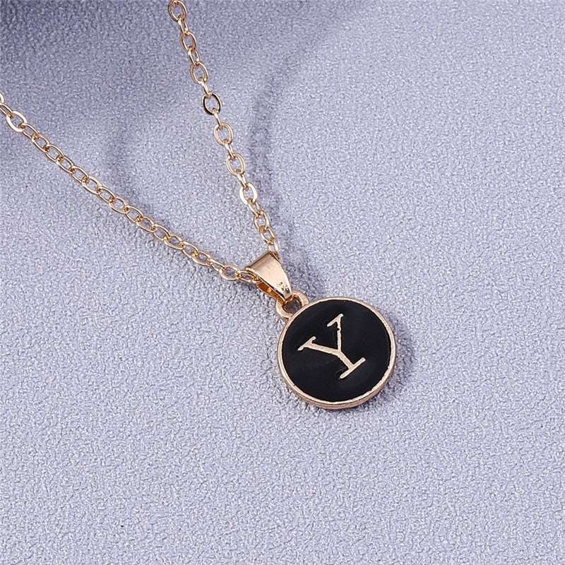 YourLetter Black Enamel Necklace with personalized letter pendant on gold chain.