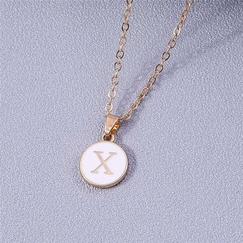 YourLetter White Enamel Circle Necklace with gold detailing and letter pendant.