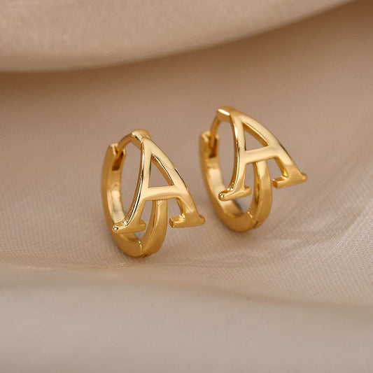 Gold initial loop earrings with customizable A-Z letter design.