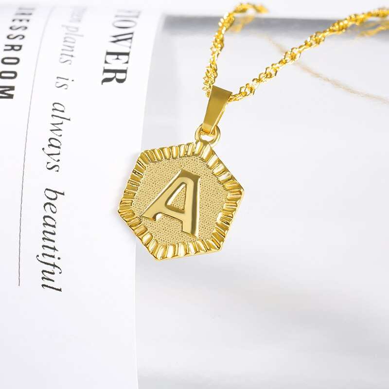 YourLetter Hexagon Embossed Necklace with gold finish and personalized letter.