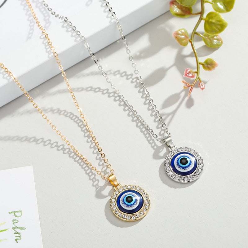 Elegant Evil Eye Necklace with gold and silver finishes and gemstone accents.